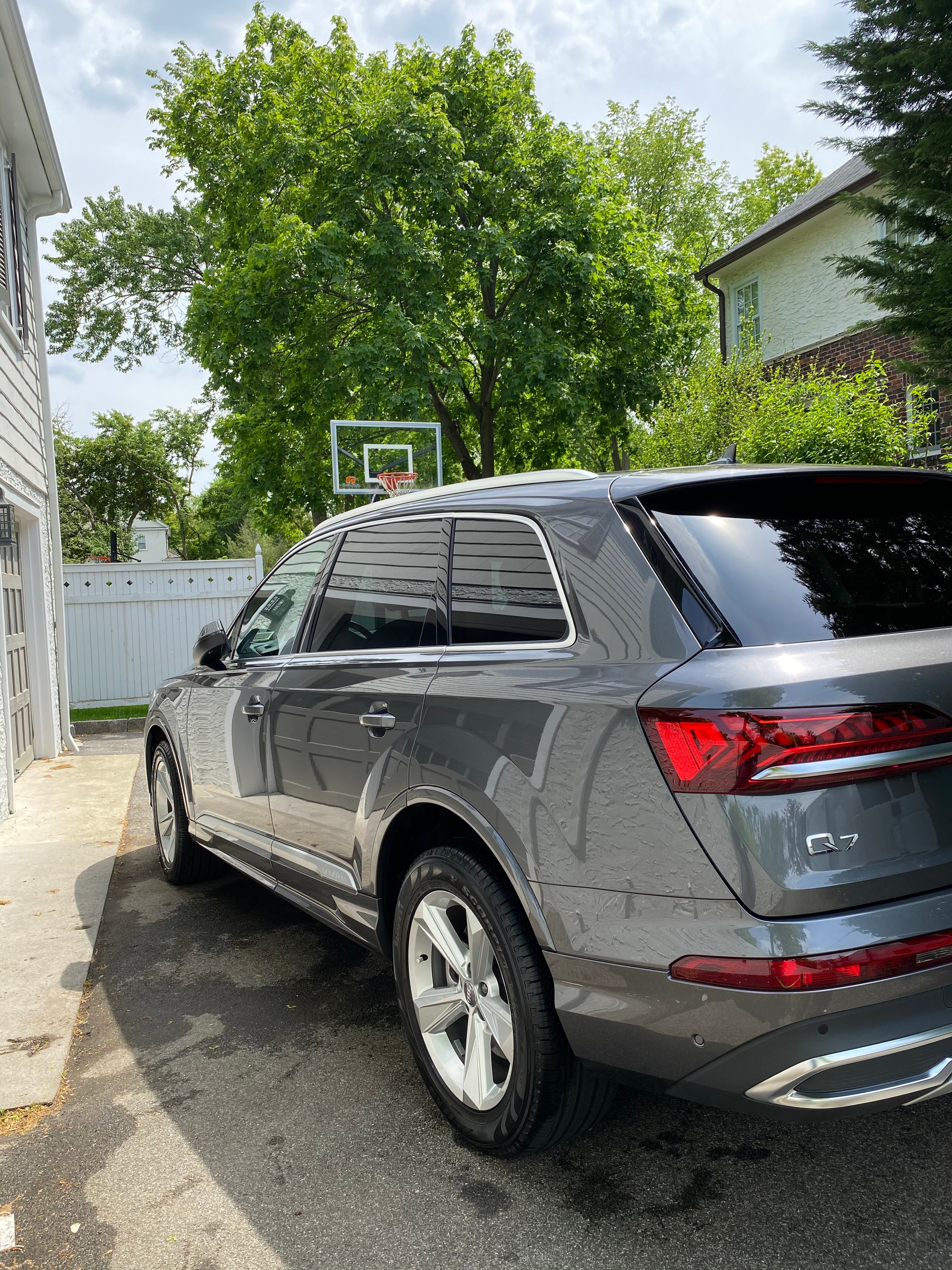 Grey Cadillac XT5 freshly detailed in a driveway